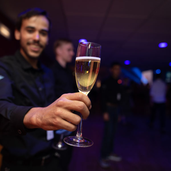 Waiter holding champagneglass